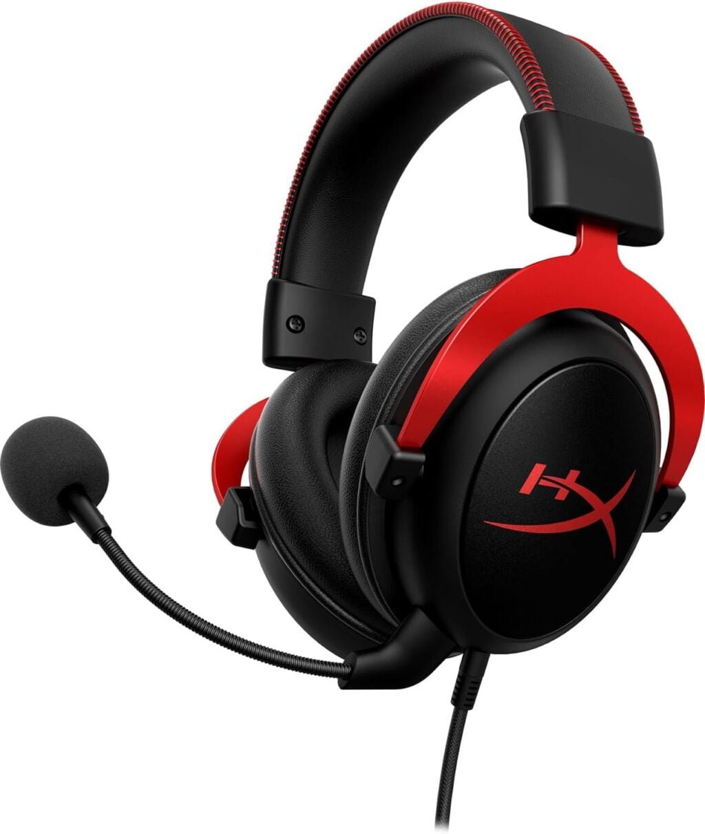 HyperX Cloud II Gaming Headset on a desktop, with PC and gaming setup in the background